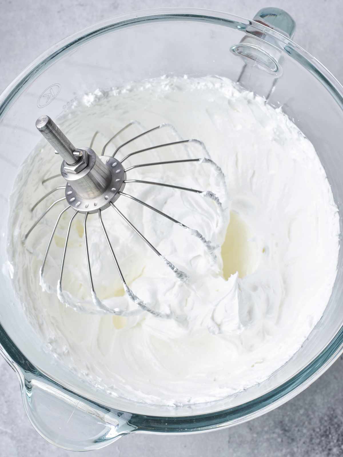Whipped egg whites in a bowl.
