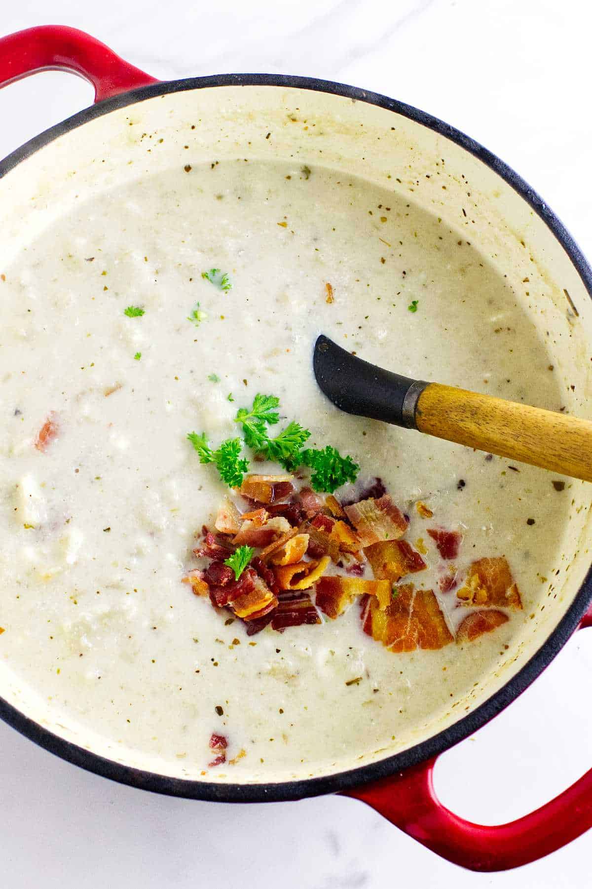 Mock potato soup with bacon in a Dutch Oven.